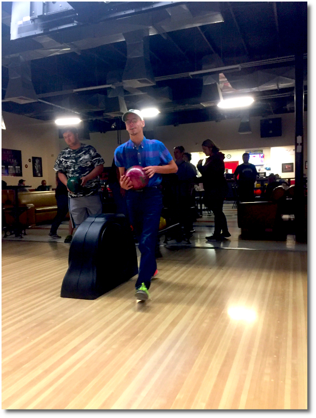 Student at bowling alley getting ready to bowl