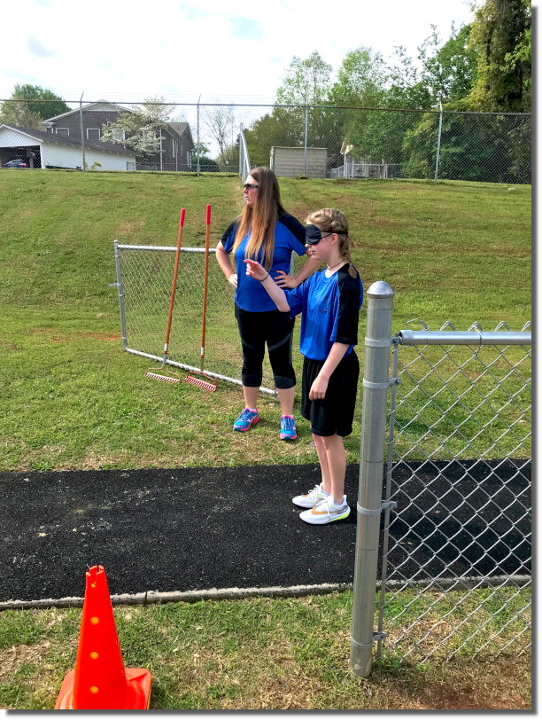Mrs. Webb and student at Field and Track